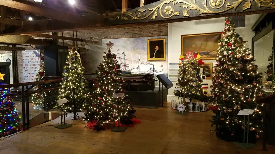 Rows of decorated trees in the museum gallery