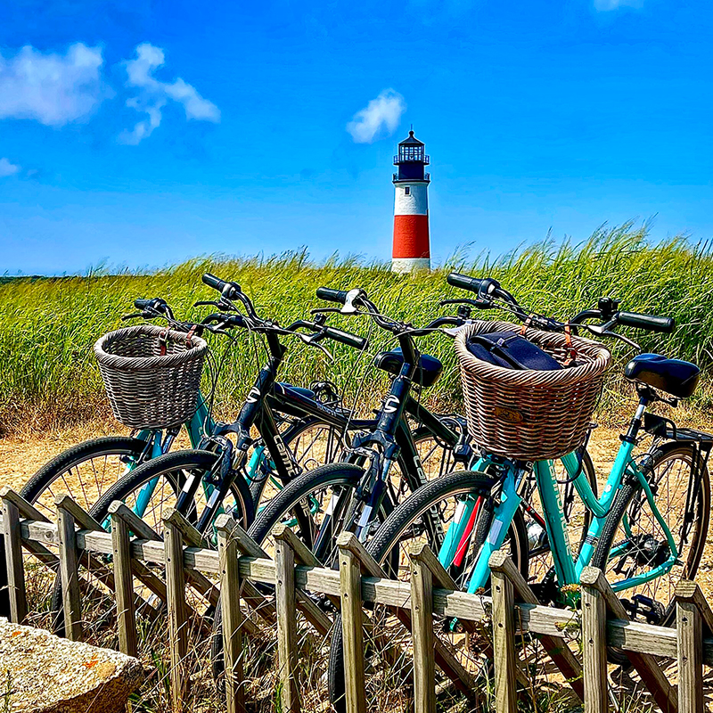 row of bikes in front of Sankaty Head Lighthouse
